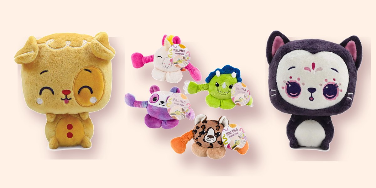 A toddler hugging a freshly-won plush at Clawz